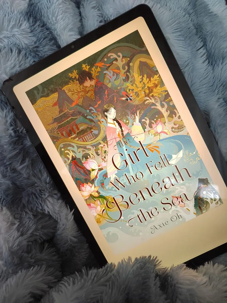 A photo of the Girl Who Fell Beneath The Sea by Axie Oh open on a tablet